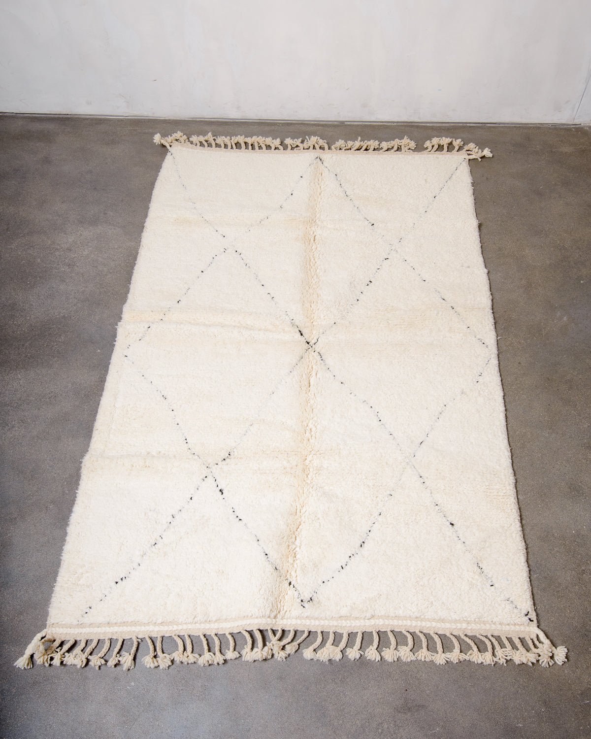 Modern, designer, handcrafted Berber rug from Morocco. Beniourain carpet with minimalist design, natural wool pile and a fluffy texture.